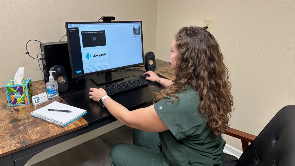 Medical staff using video conferencing equipment