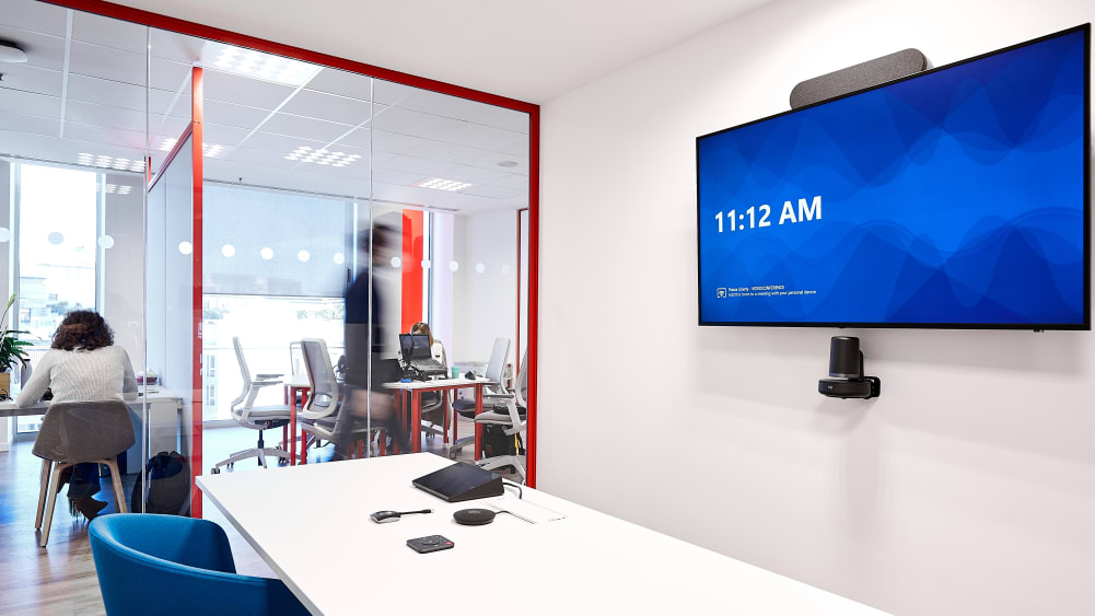 Huddle room with video conferencing equipment