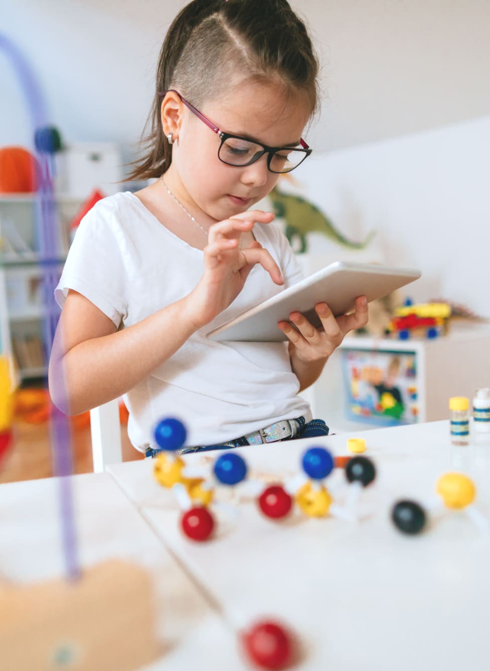 A young girl with a tablet.