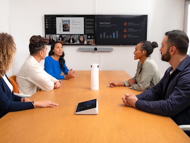 Five people in a meeting room on a video call equipped with Sight AI camera