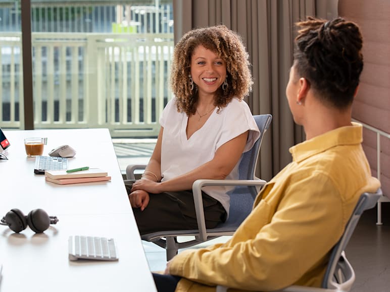 Colleagues collaborating in office