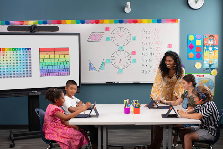 Teacher engages with students in learning activity