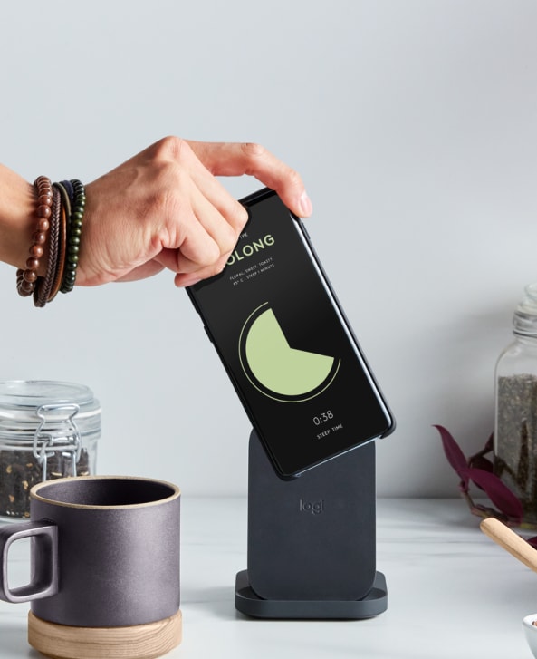 Phone being placed on Logitech Powered Stand