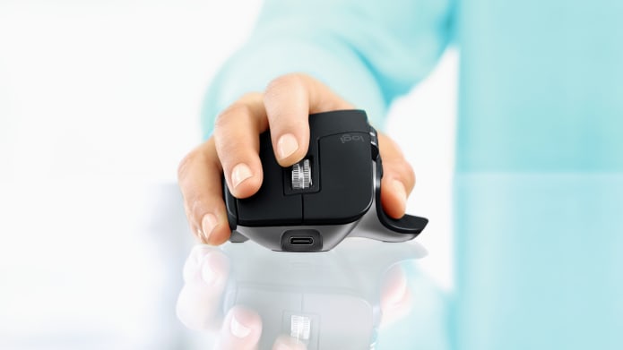 Hand of man using MX Master for Mac mouse