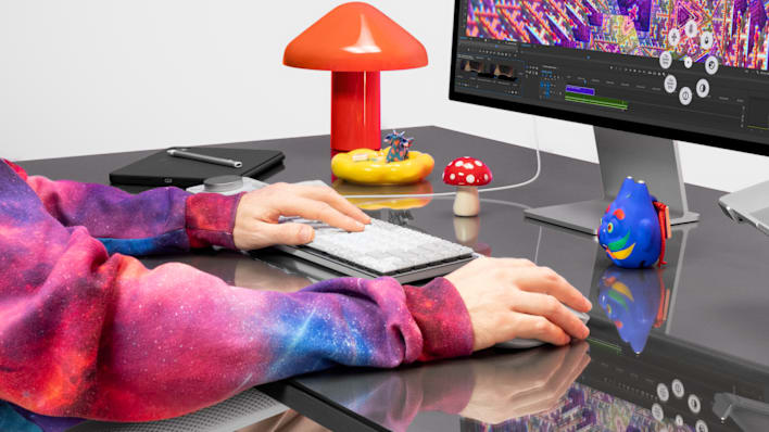 Person working with MX Mechanical keyboard and Master 4 mouse